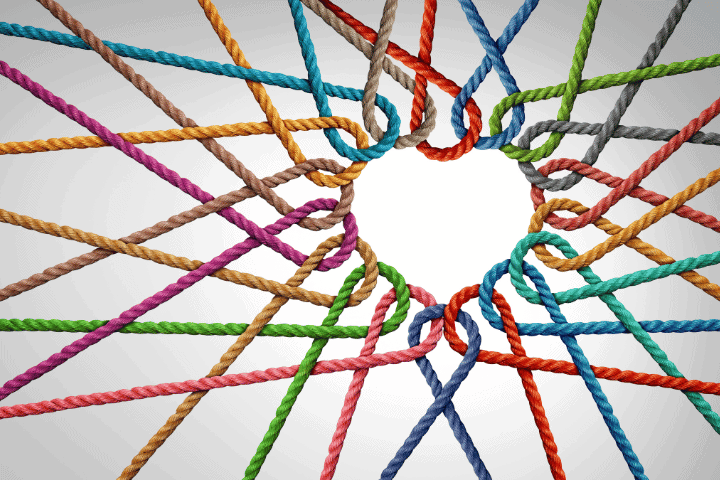 marketing at the heart of every business concept is shown via multiple colourful ropes intertwined and creating a heart shape outline