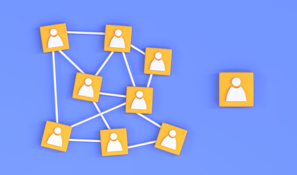 The concept is : be social on social media. the image shows a multiple wooden blocks with people outlines on thine all connected by lines.