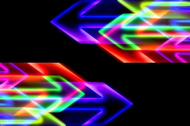 Inbound Marketing vs Outbound Marketing concept depicted by neon arrows pointing at each other, they depict motion.