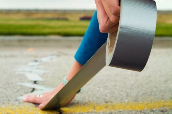Tape measure on road depicting measurement and progress in marketing campaigns.